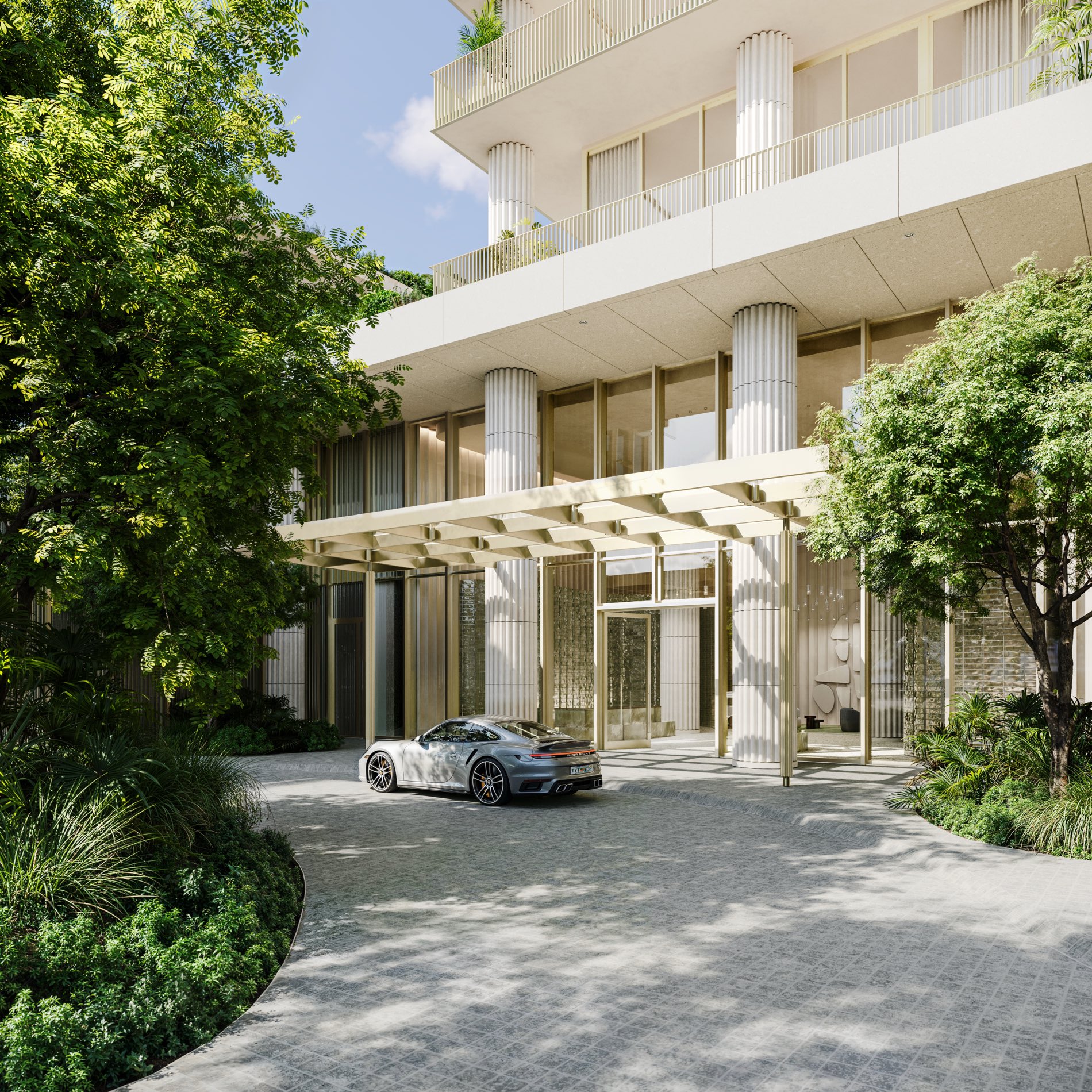 Fouquet's Hotel & Residences in the Miami Design District — the David Chipperfield tower and its cream stone-lattice podium rising above tree-lined 39th Street.