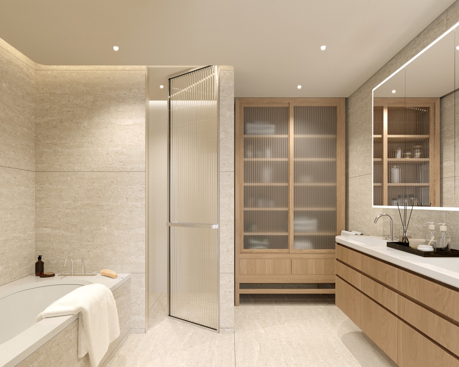 A primary bathroom at Fouquet's Hotel & Residences — porcelain flooring, a natural oak custom vanity with quartz countertop, stainless fittings, and a countersunk oval tub beneath the window.